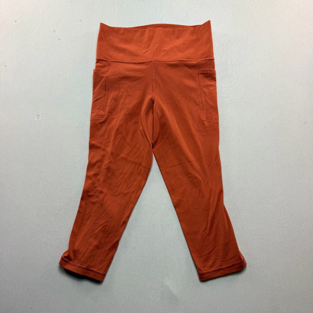 Athleta Salutation Stash Pocket II Capri Women Small Orange Excellent Leggings